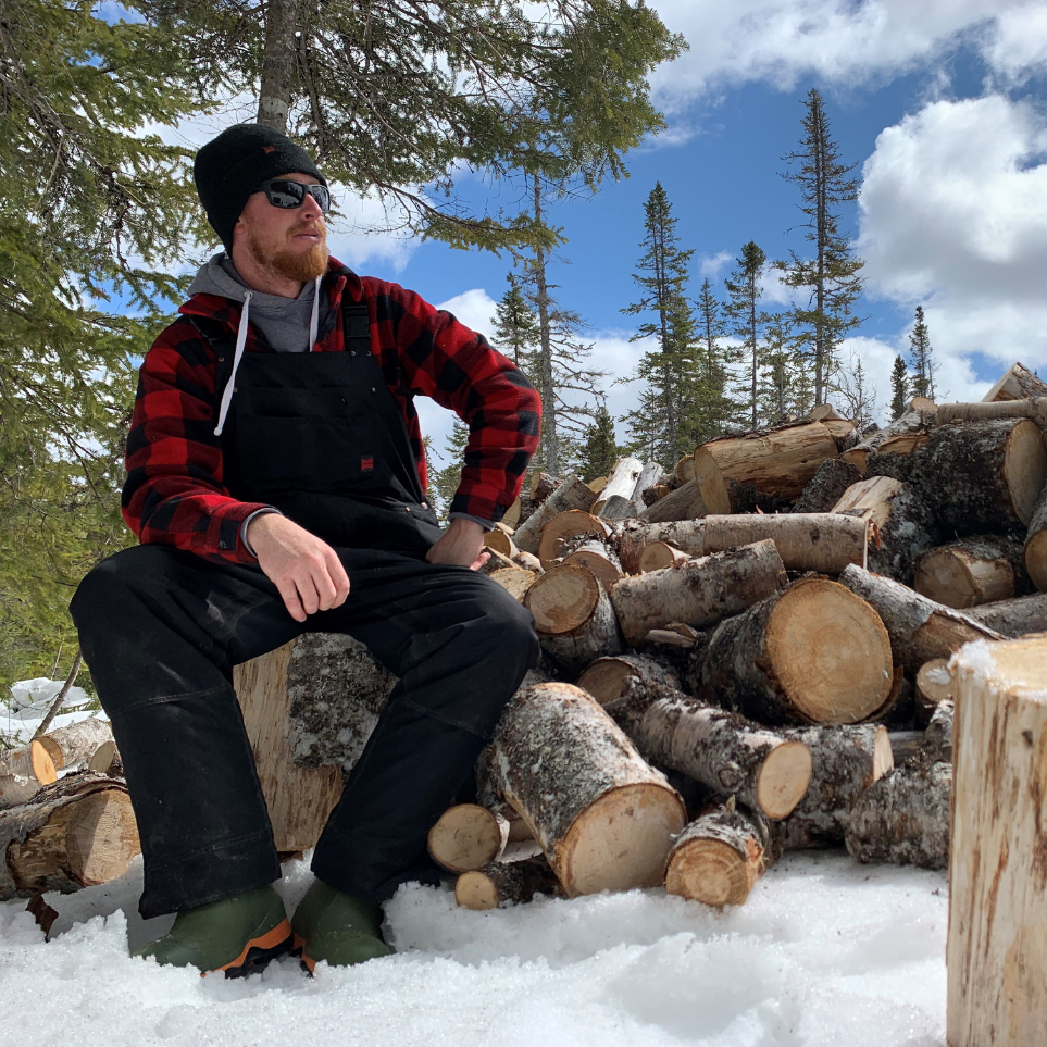 A man wearing 7910 overall in black