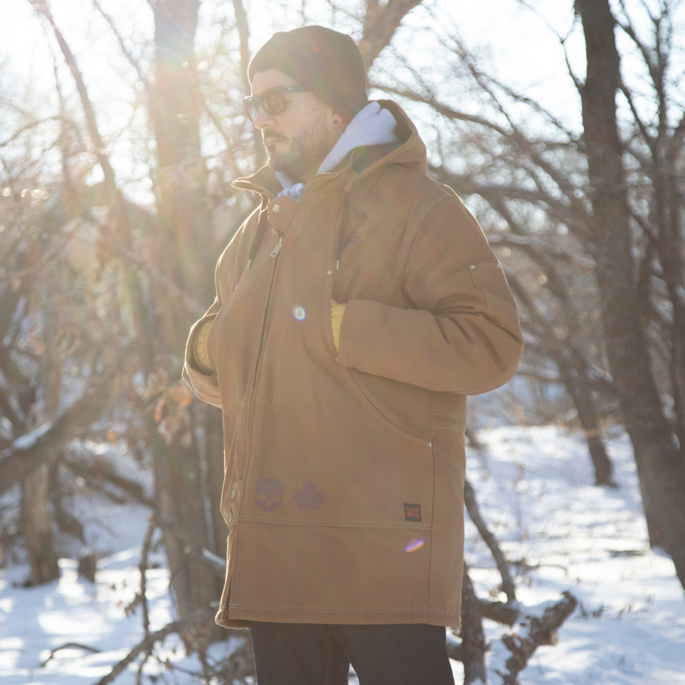 A man wearing a WJ18 Brown parka